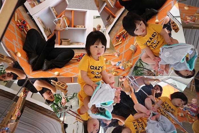 Child discovering herself through mirrors at Guardian Richmond