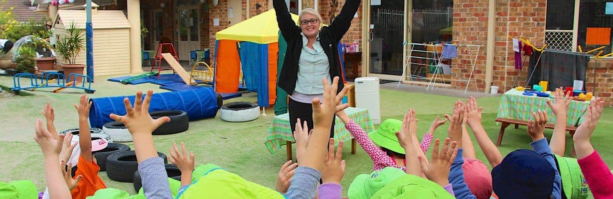 children with hands up at Guardian west pennant hills sydney