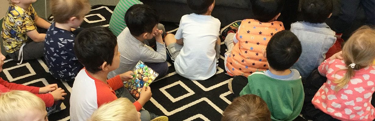 Children sitting on floor listening to Autism talk at Guardian Roseville