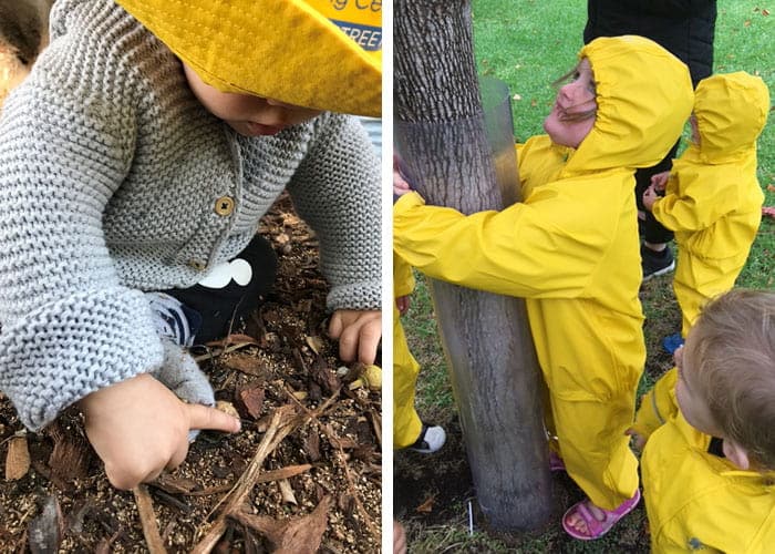 Children from Guardian Collins Street wearing yellow raincoats and hugging tree