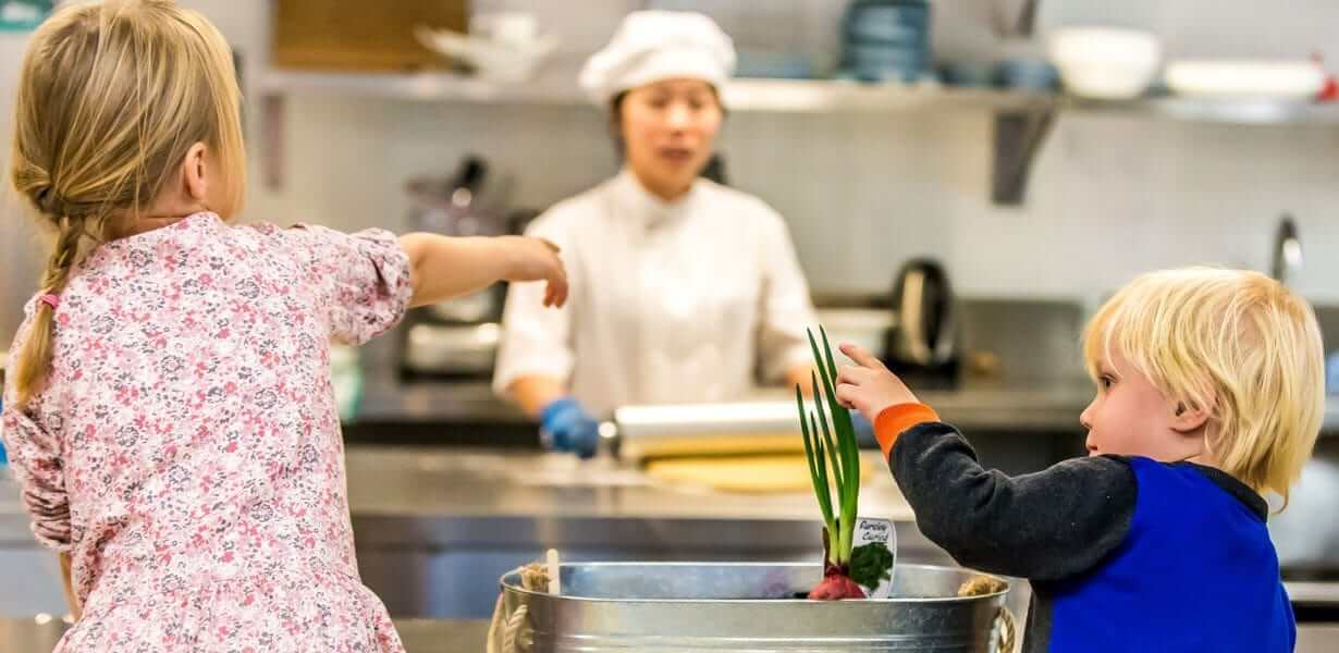 Two children and Chef interacting - nutrition