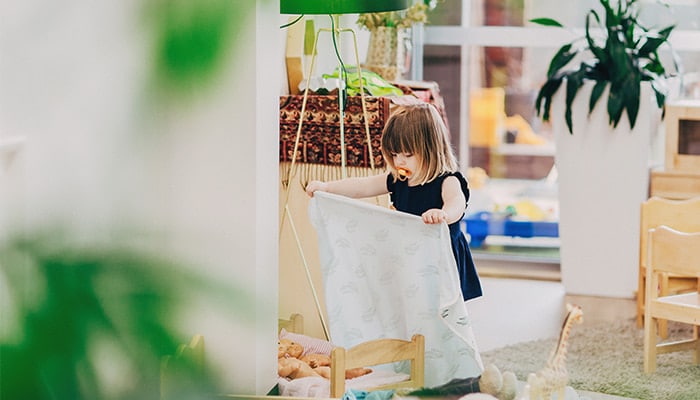 child folding blanket