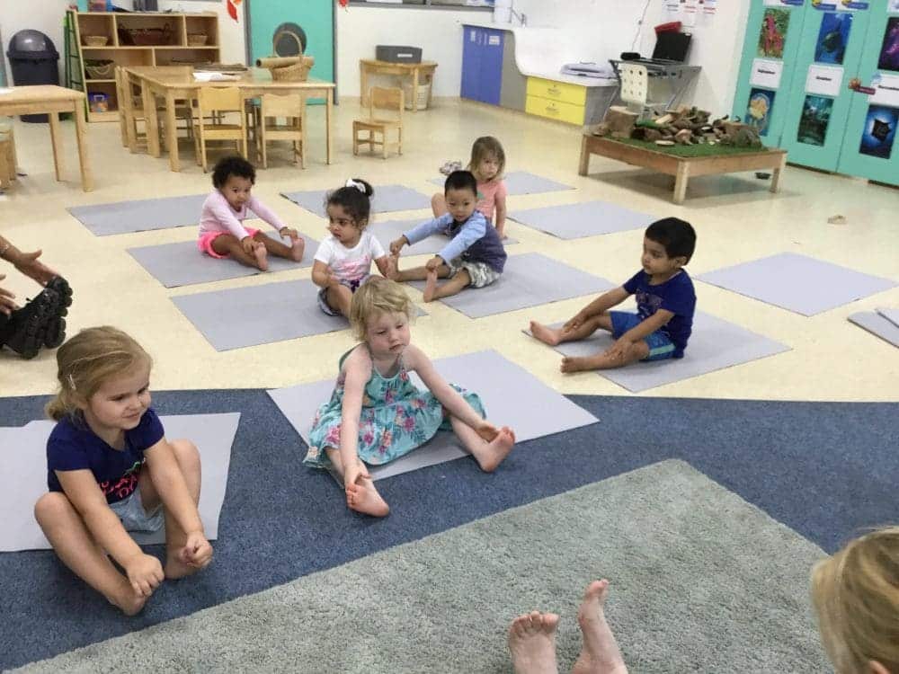 Children at Guardian Tempe on yoga mats practising mindfulness