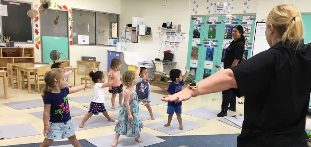 children stretching in yoga classes at Tempe