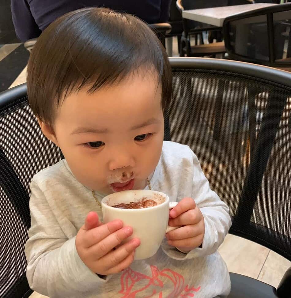 baby in cafe having babyccino on daily excursions
