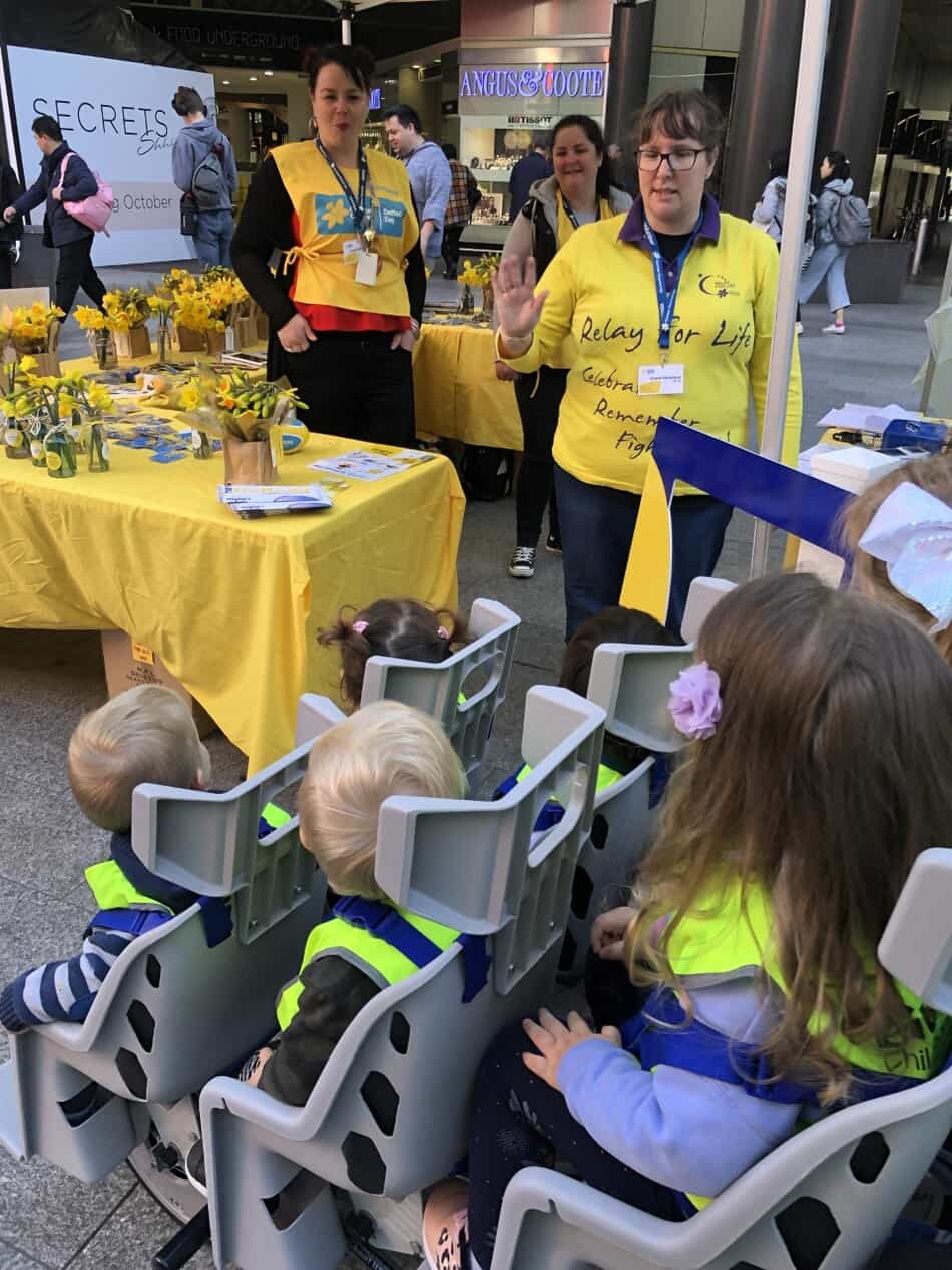 children buying daffodils at Daffodil Day stall