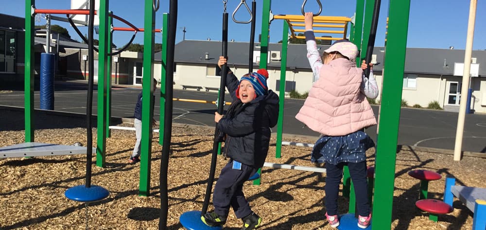 children playing on playground on an excursion