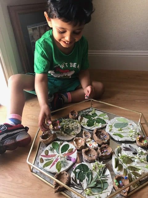 child making diyas and Rangoli for Diwali