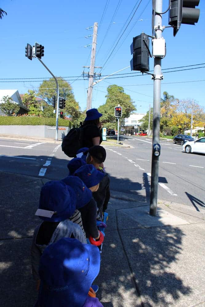 children walking in a line on an excursion