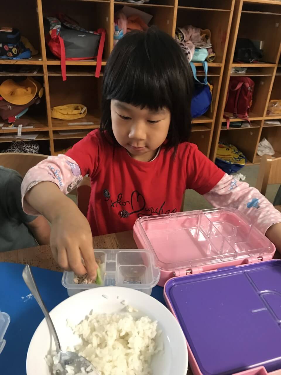 child making sushi in transition to school program