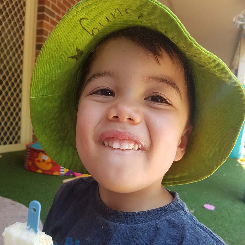 child eating homemade ice blocks