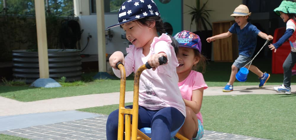 children on bicycle at playdate