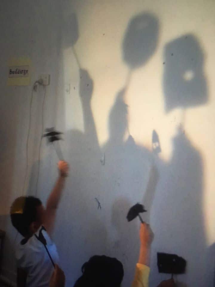 children exploring shadows with a projector