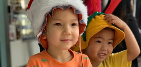 children raising money for farmers at Christmas BBQ
