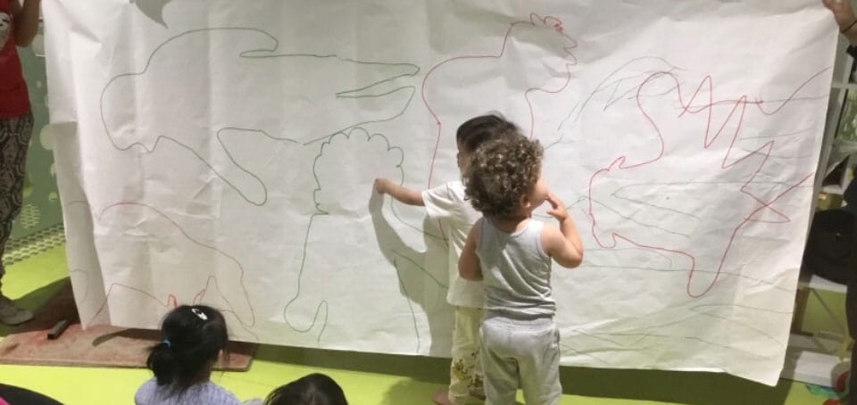 children exploring shadows, science and movement at Summer Rain program