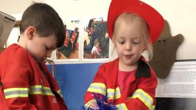 children using role play to explore bushfires and firefighters