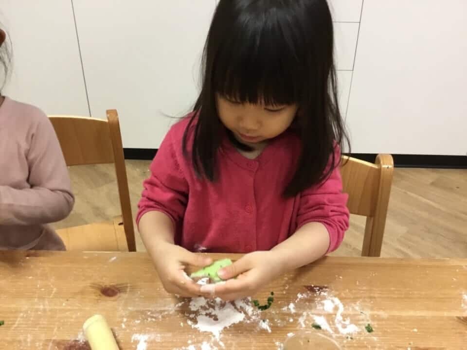 child making dumplings for Chinese New Year