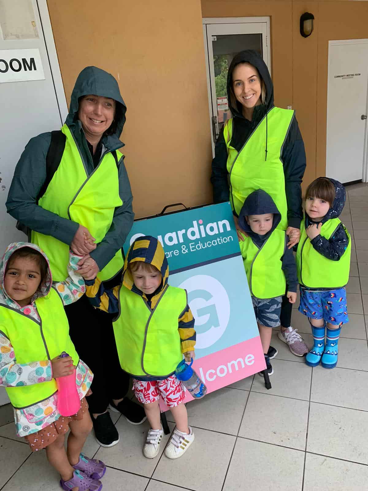 Children and Educators in Guardian safety vests, on way to first swimming lesson