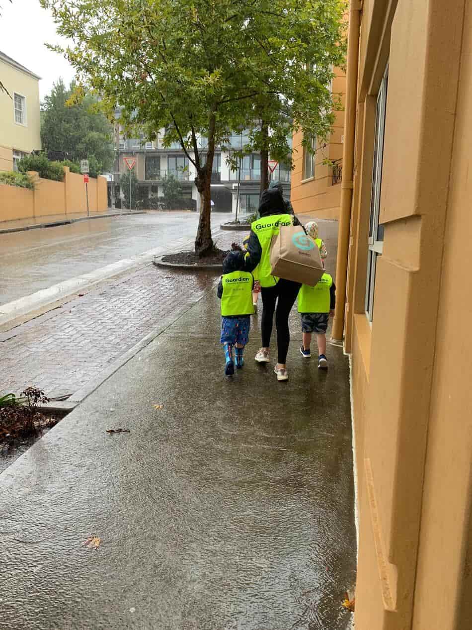 children walking on footpath to swimming lesson