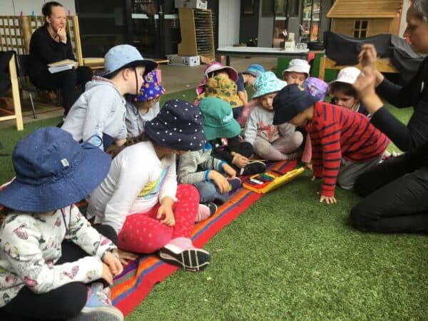 children exploring colour and rainbow through song