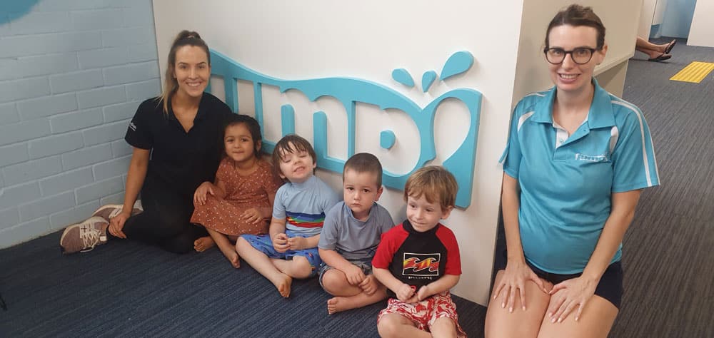 children at jump swim school for a swimming lesson