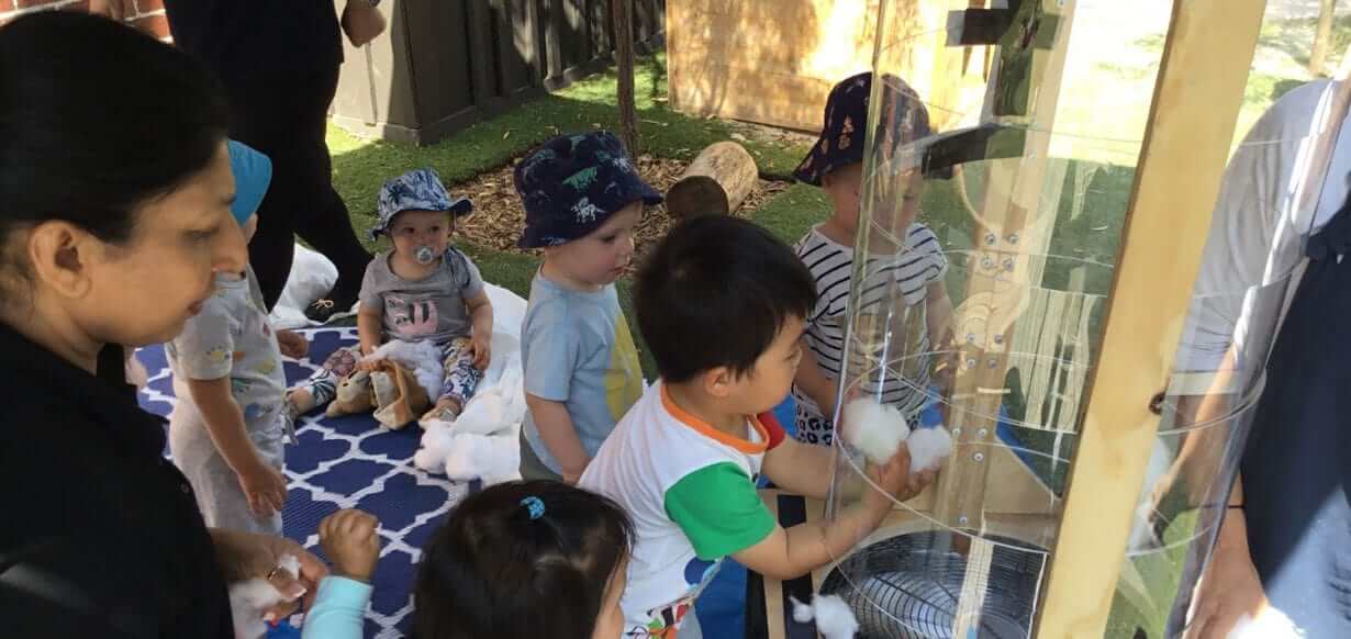 Guardian Mckinnon children exploring wind during Summer Rain program