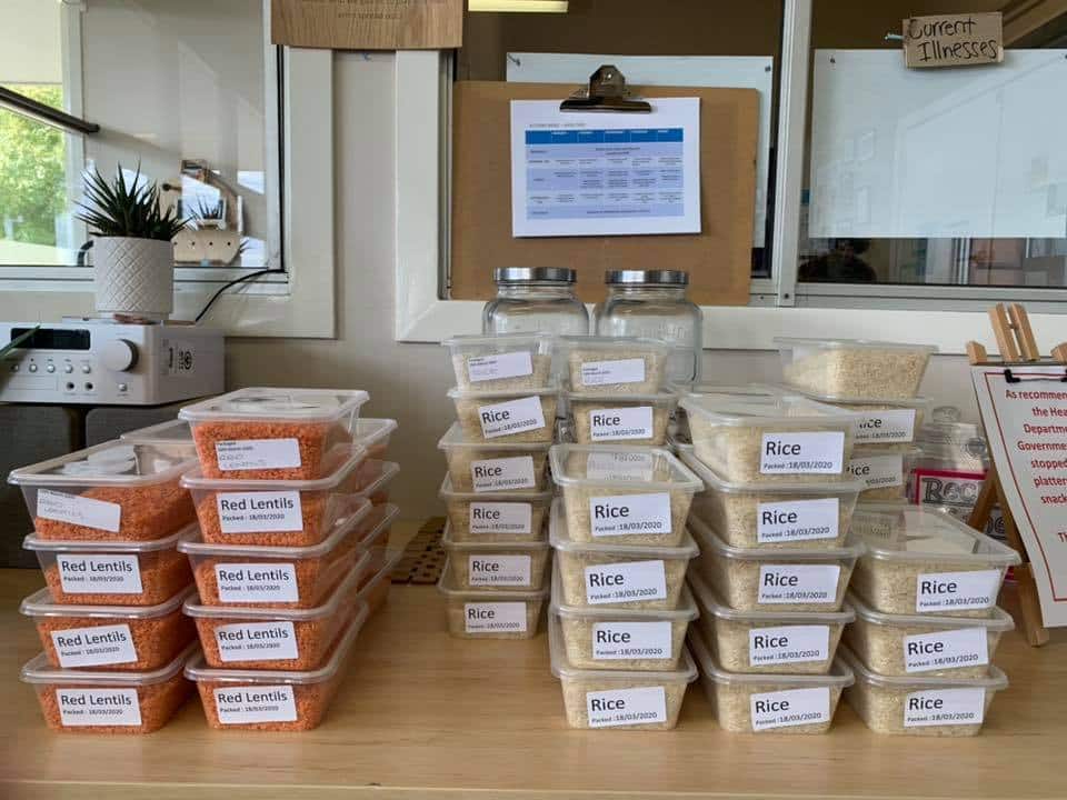 containers of rice and lentils stacked in community pantry