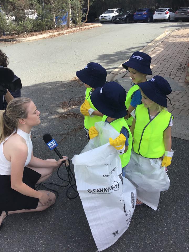 children at Guardian Bruce wearing safety vests and talking to WIN News reporter