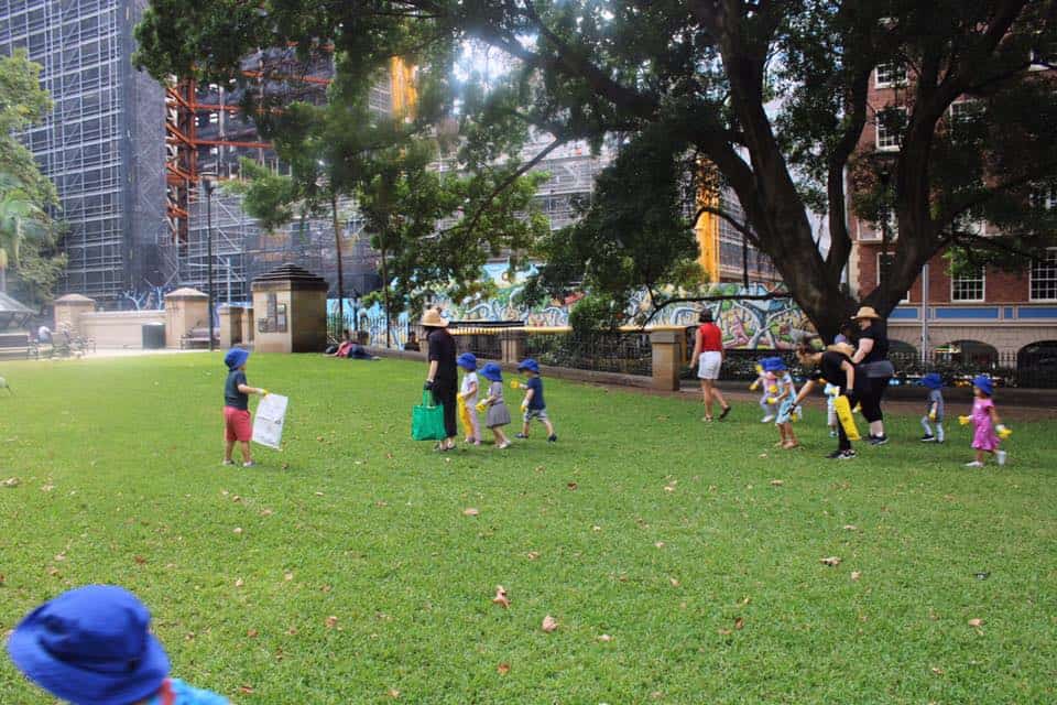 children from Guardian Kent Street cleaning up local park for Clean Up Australia Day