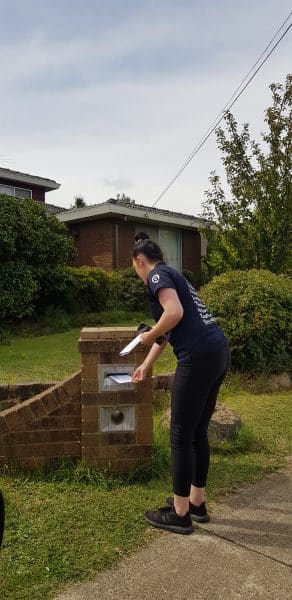 Educator delivering letters to children isolating at home