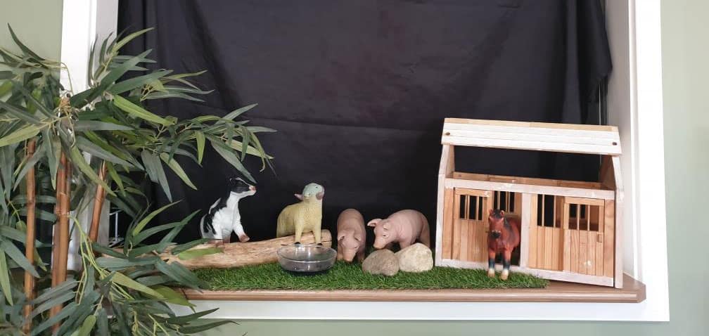 puppet show set up in window of childcare centre