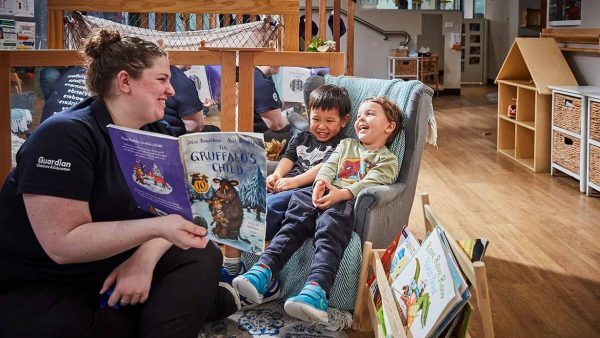 Educator reading book to children at Guardian Market Street Darling view