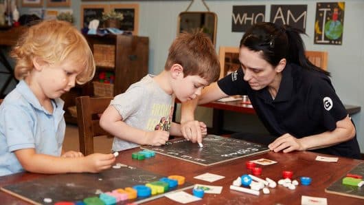 Children playing with Educator inside at Lilyfield