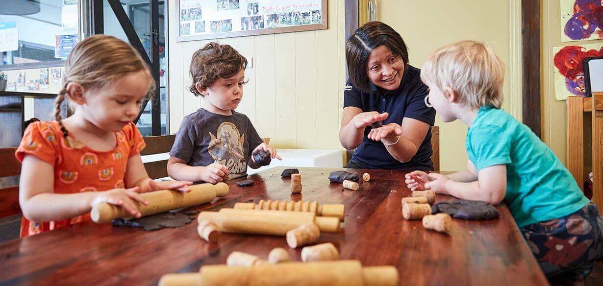 Children playing with toys inside and educator Lilyfield