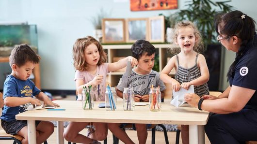 Children colouring with Educator at Export Park