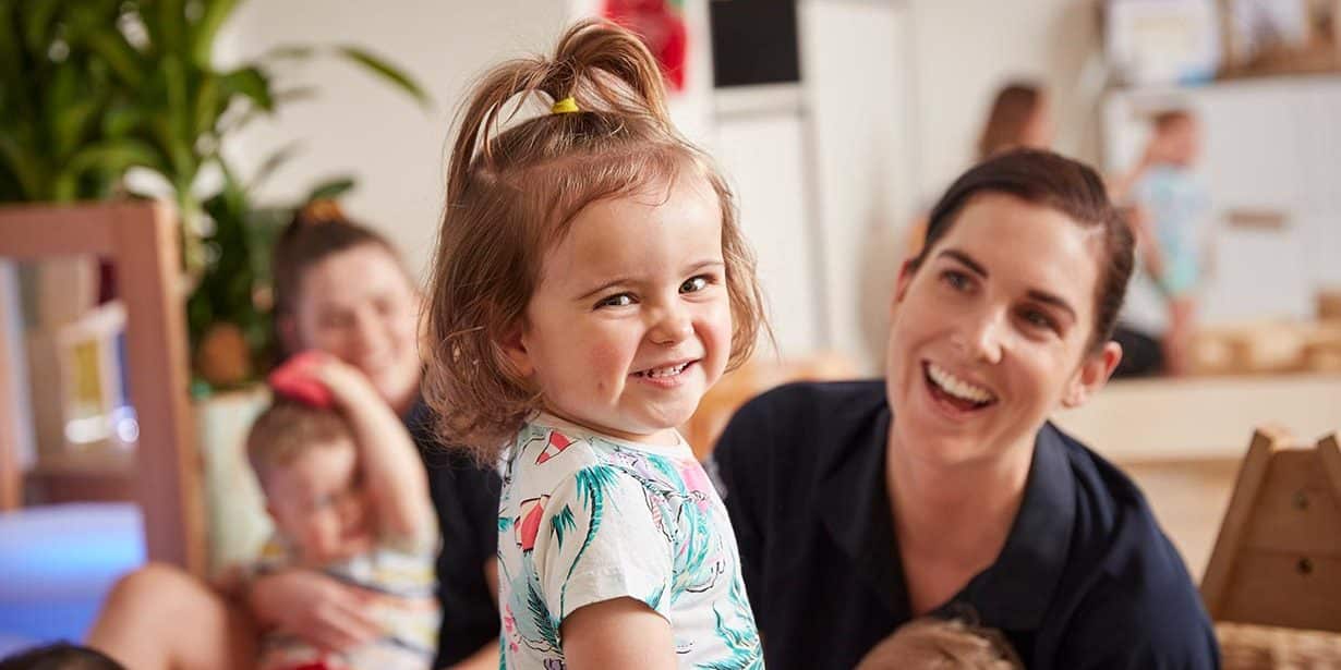 Child laughing with educator at Flinders Street