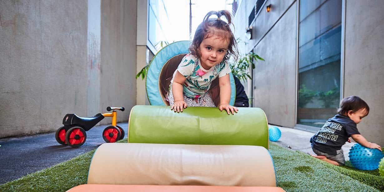 Child playing on equipment at Filnders Street