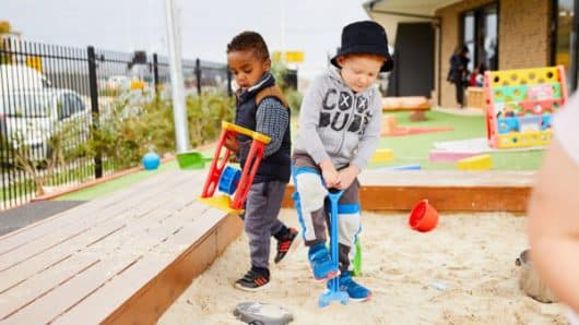 two-little-boys-playing-in-sandpit-600x400