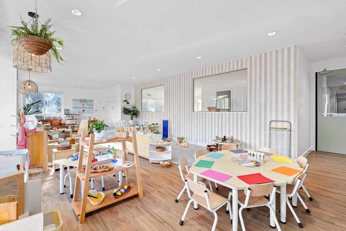 Bright and organised early learning classroom at Guardian Childcare Aspendale, showcasing diverse learning zones and natural materials.