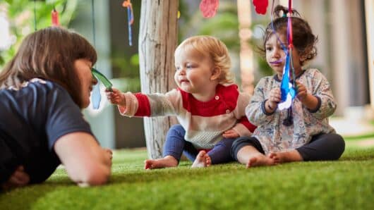 Baby and educator at Guardian childcare centre