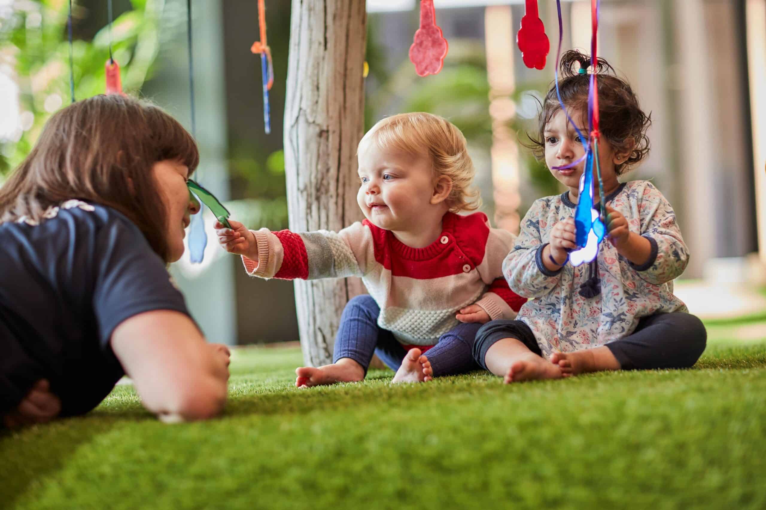 Baby and educator at Guardian childcare centre