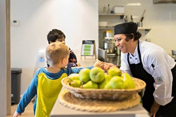 Chef interacting with children at Guardian Childcare centre