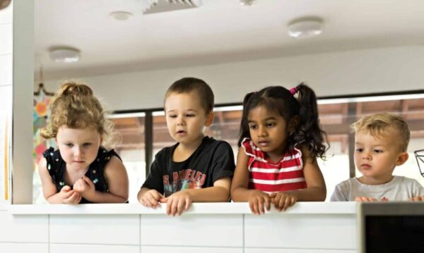 Children looking at food prep in a Guardian Childcare centre