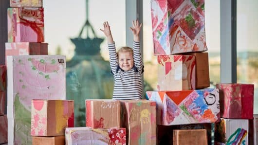 Girl playing with boxes at Guardian childcare centre center