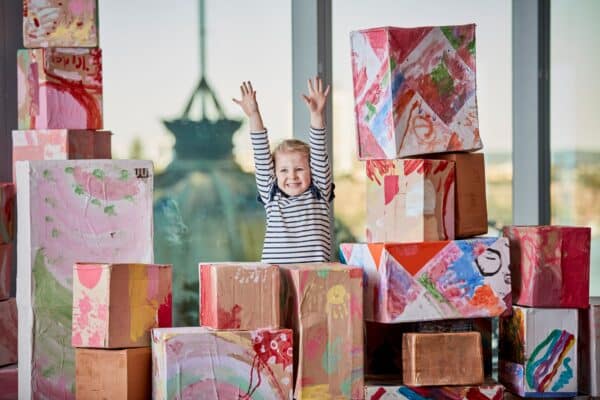 Girl playing with boxes at Guardian childcare centre center