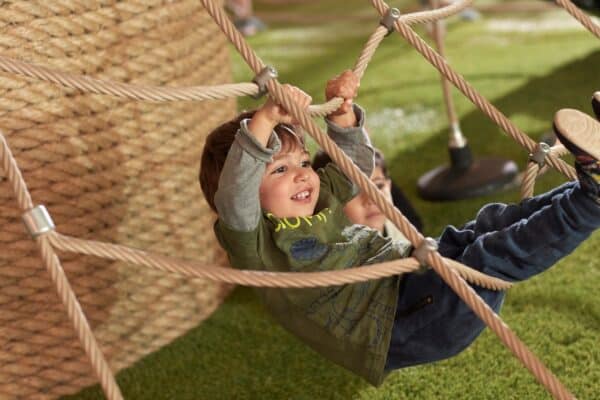 Child playing on ropes at Guardian childcare centre