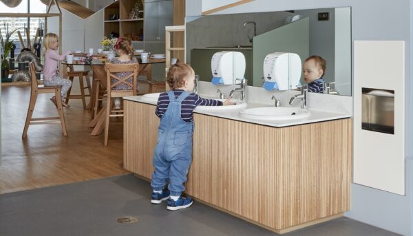 Child washing hands in Guardian childcare centre