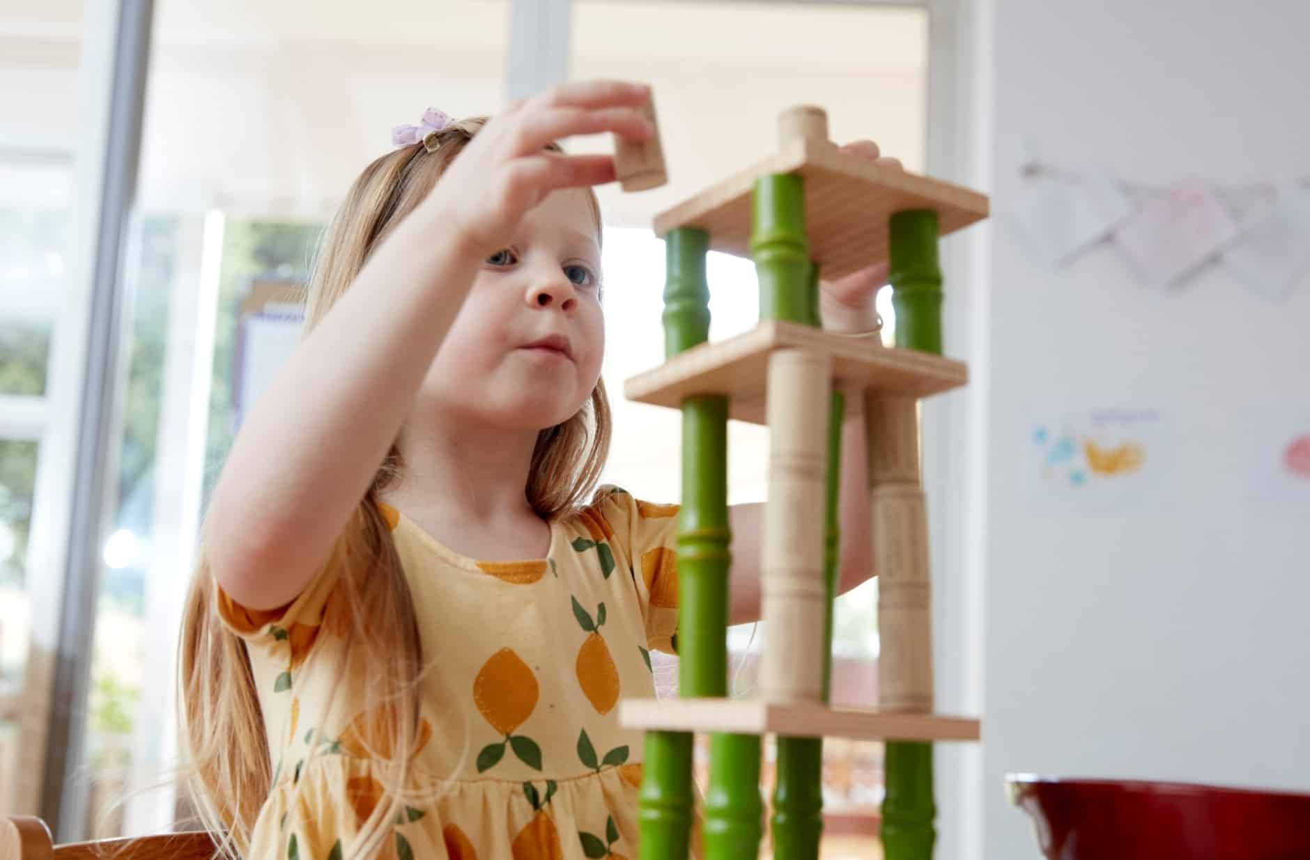 Child building using blocks at Guardian Childcare Centre