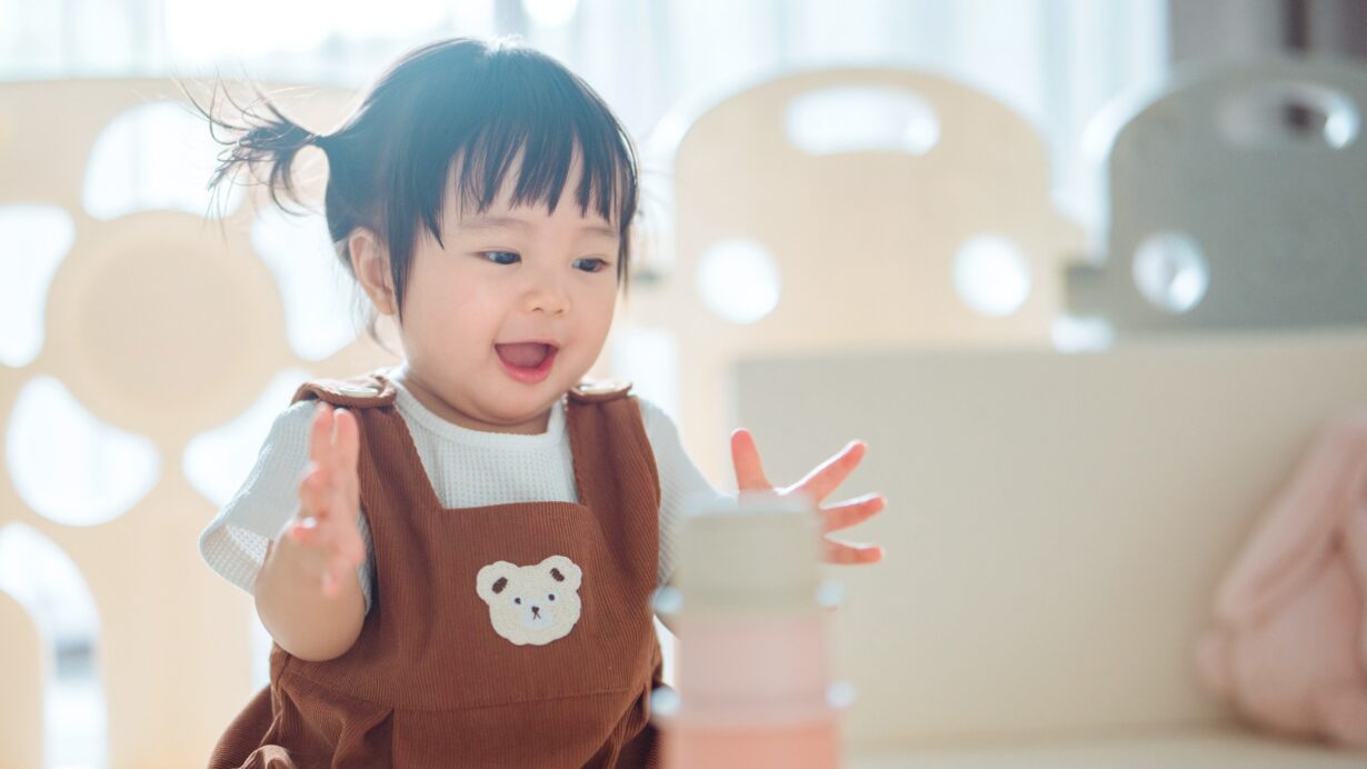 Young child in childcare setting expressing wonder